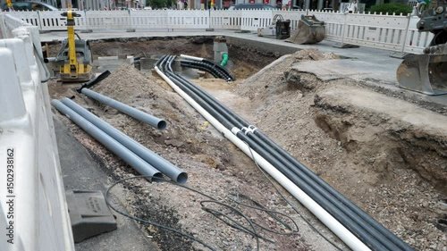 Installation of district heating lines and water pipes. Large open excavation site in the city center of Wiesbaden