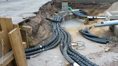 Installation of district heating lines and water pipes. Large open excavation site in the city center of Wiesbaden