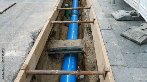 Installation of district heating lines and water pipes. Large open excavation site in the city center of Wiesbaden