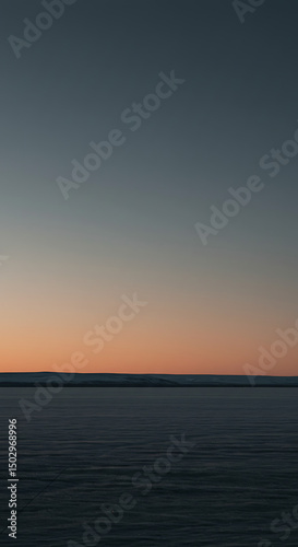 Serene Winter Sunset Landscape Frozen Lake and Distant Hills at Dusk
