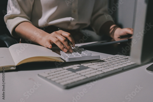 Expert woman asian female people review data number costing managerial account prepare monthly actual cost variance report at tax audit office. ESG sheet budget control ERP process service project.