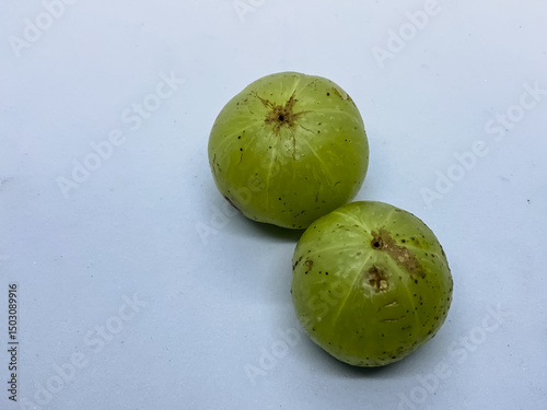 Indian gooseberries, also known as amla two fruits 