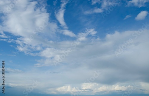 Blue sky with beautiful white clouds. Sky with cumulus and cirrocumulus clouds.