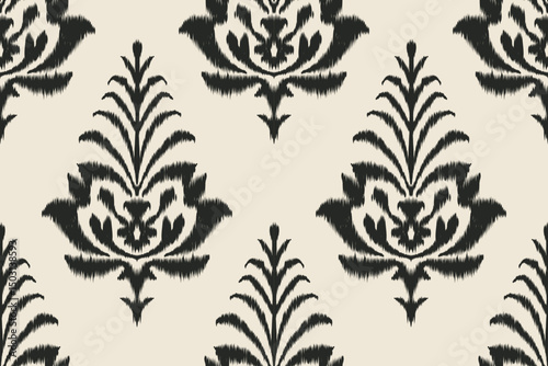 Traditional black ikat pattern with floral motifs on beige background for textile and decor.