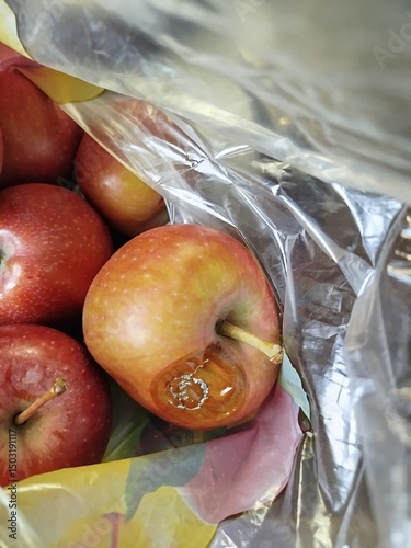 Rotten Apples inside Clear Plastic Bag