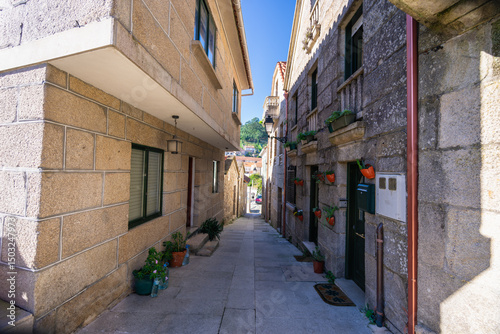 Explore the charming stone architecture and unique cruceiros of Combarro, a traditional Galician village in Spain. photo