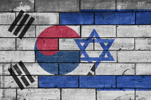 colourful painted big national flag of south korea and flag of israel on a massive old brick wall background. concept
