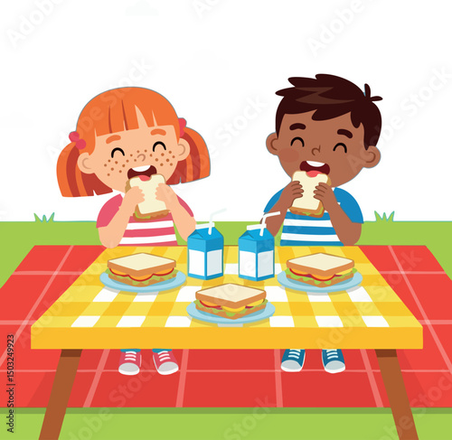 Children eating sandwiches and drinking milk at picnic table outdoors in summer 