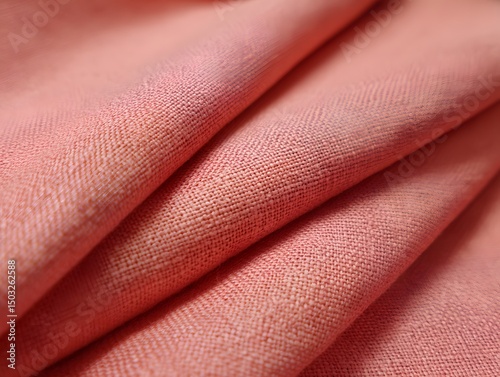 Peach Fabric Folds: Delicate folds of peach-colored fabric create a soft, textured pattern, evoking feelings of comfort and luxury.