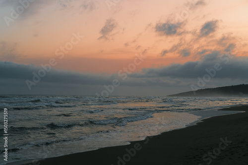 Incredible sunset over the sea in red-orange and blue tones