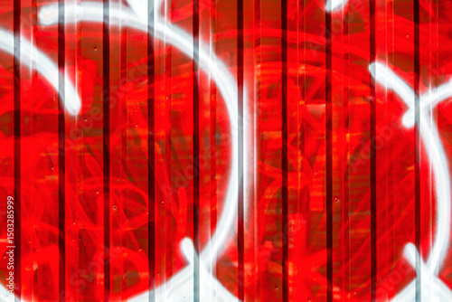 abstract geometric shapes of spray paint on corrugated metal surface. red and white colors.