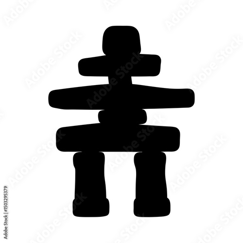 Silhouette of an Inukshuk a traditional Inuit stone landmark or cairn