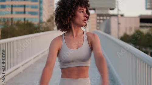 Woman Stretching On City Bridge
