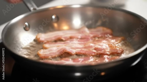 Bacon frying in a pan