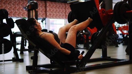 young woman exercising in gym