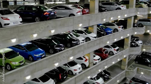 Timelapse of multilevel urban parking garage with changing light