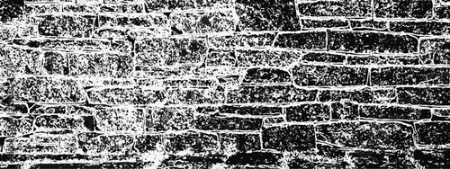  brick wall with a rough stone surface. visible mortar adds texture to the design, creating a visually appealing pattern grunge background.