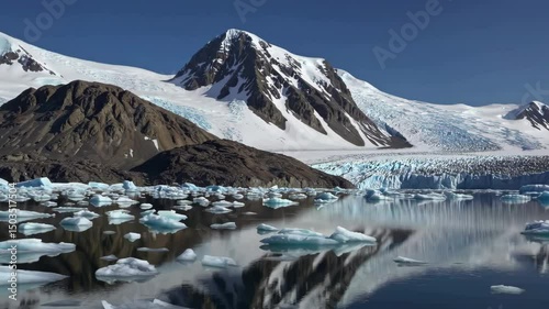 Majestic glacial landscape reflections in pristine arctic waters under clear blue skies
