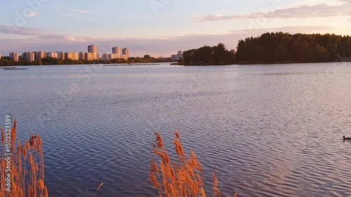 Slow motion footage of the sun setting by the lake. Nature