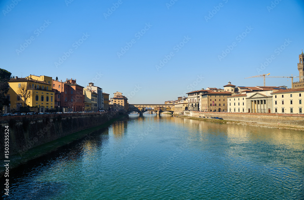Obraz premium View of the river Arno and buildings from the embankment in Florence. High quality photo