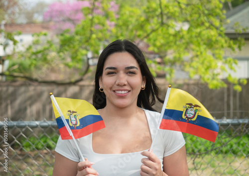 Young Woman holding flags from Ecuador in USA