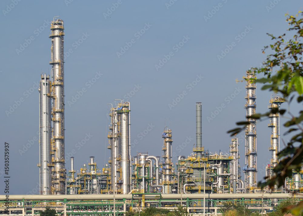 Distillation tank and pipeline in oil gas refinery plant in Map Ta Phut, Rayong. May called petroleum or petrochemical plant. Industrial factory building to production gasoline, fuel or power energy Distillation tank and pipeline in oil gas refinery plant in Map Ta Phut, Rayong. May called petroleum or petrochemical plant. Industrial factory building to production gasoline, fuel or power energy