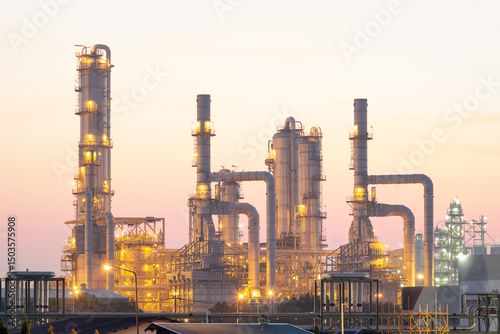 Oil gas refinery plant in Map Ta Phut, Rayong at morning. May called petroleum or petrochemical plant. Warm color tone with orange, yellow color. Processing plant to production gasoline fuel energy.