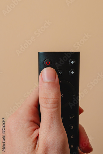 Power button. Human pressing the power button. Equipment control