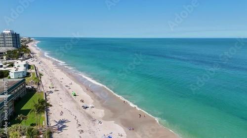 Wallpaper Mural Tourists and locals enjoying a beautiful sunny beach day along the shores of Vero Beach in Indian River County, Florida.  Torontodigital.ca
