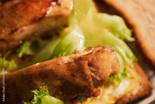Fototapeta Naklejka Na Ścianę i Meble -  Delicious Chicken Sandwich with Crispy Lettuce