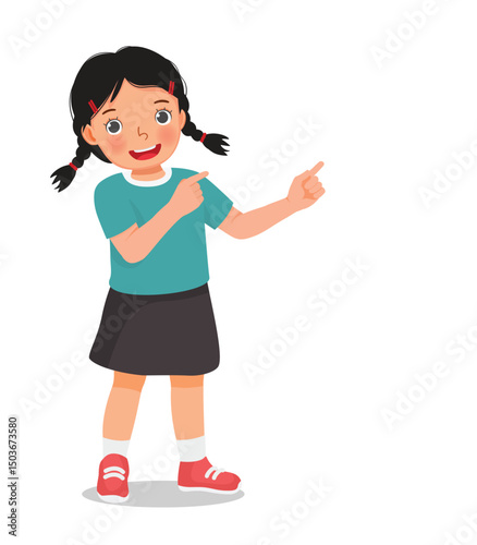 Little girl pointing finger to right side at copy space