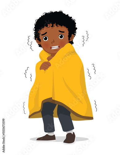 Little African boy trembling and shivering feeling cold covered with blanket
