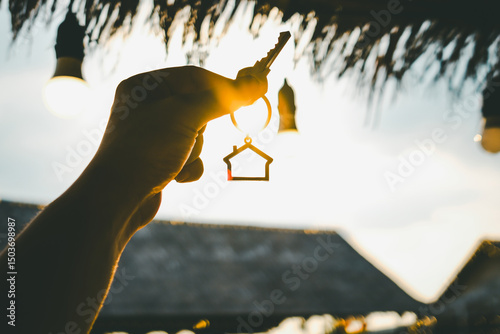 House model and key in home insurance broker agent ‘s hand or in salesman person. Real estate agent offer house, property insurance and security, affordable housing concepts photo