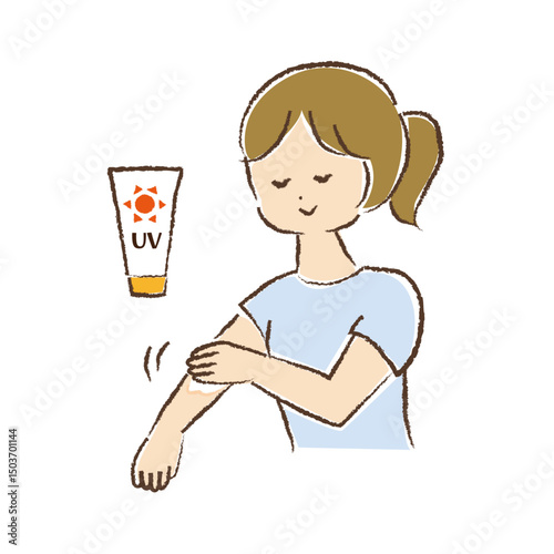 腕に日焼け止めクリームを塗っている女性