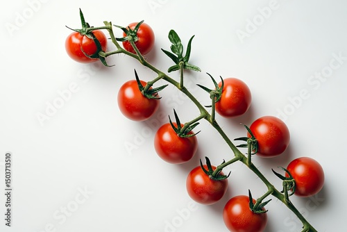 Fresh, vibrant cherry tomatoes on a stem against a white background