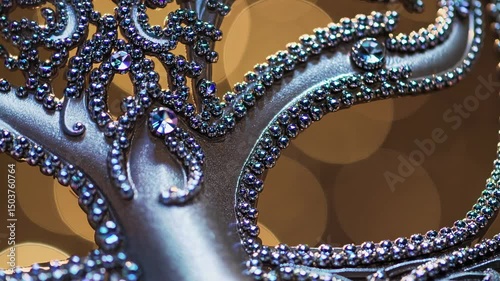 Close-up angle of an ornate, bejeweled mask with intricate details, capturing a glamorous, mysterious vibe suitable for a masquerade-themed video.