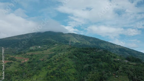 4K Drone Footage of Lush Hills with Distant Telecom Tower

