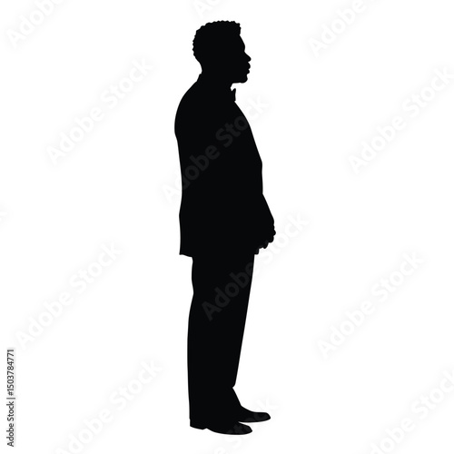Silhouette of a man in a suit standing profile