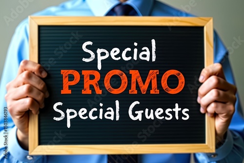 Man holds sign: special guests are crucial to event