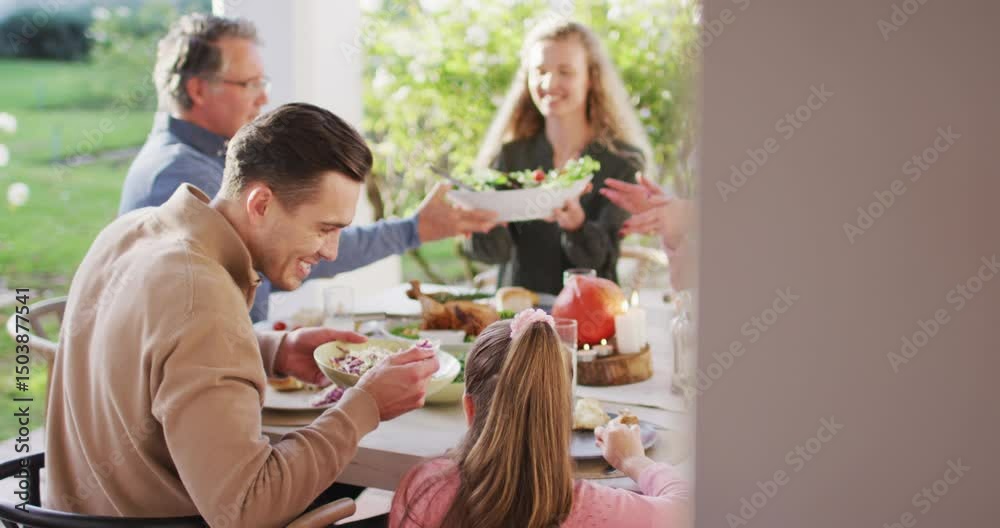 Video of happy caucasian parents, daughter and grandparents serving food at outdoor table Video of happy caucasian parents, daughter and grandparents serving food at outdoor table