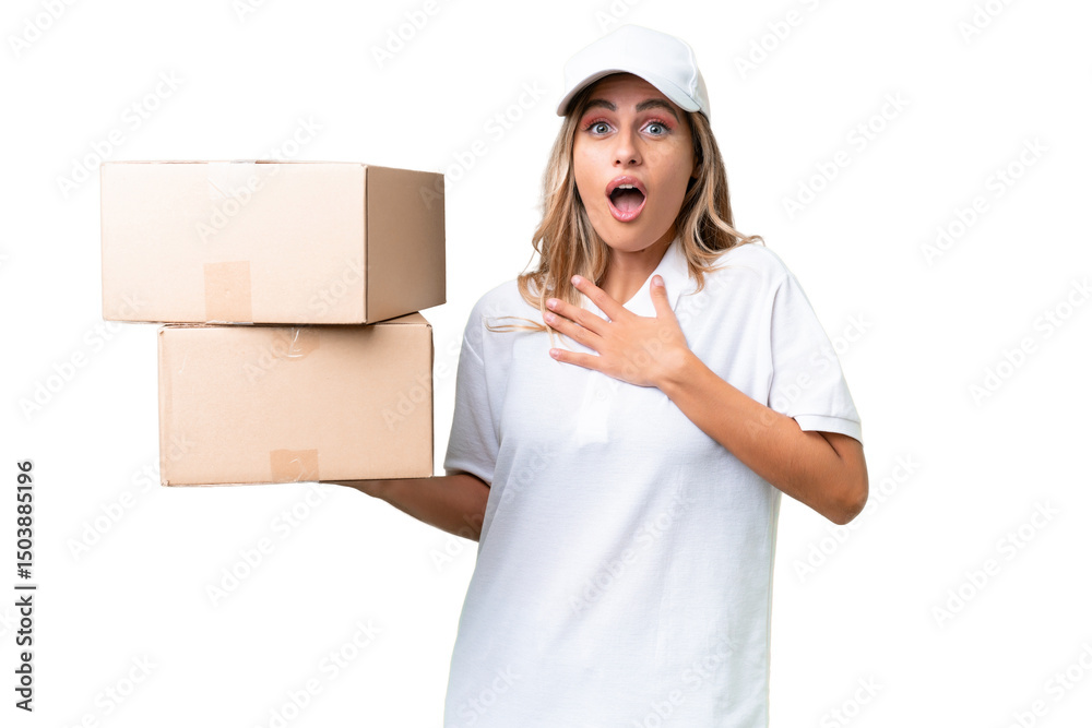 Delivery Uruguayan woman over isolated background surprised and shocked while looking right Delivery Uruguayan woman over isolated background surprised and shocked while looking right