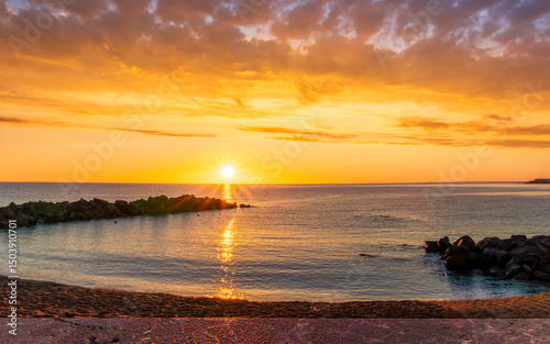 Fototapeta Naklejka Na Ścianę i Meble -  morning or evening landscape with nice beach during sunrise or sunset in sea with amazing isle with rocks and beautiful clouds on background
