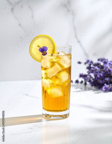 Refreshing glass of lemonade perfectly chilled with a bright yellow hue and inviting appearance ideal for hot summer days and enjoyable social gatherings outdoors