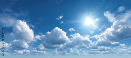Bright Sunny Day with Fluffy Cumulus Clouds in a Blue Sky
