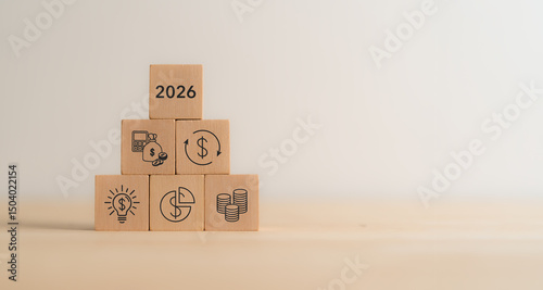 2026 Budget and financial planning strategy concept. Wooden blocks with the icons related to budgeting, investment and financial strategy. Strategy for efficient budget allocation, budget management.
