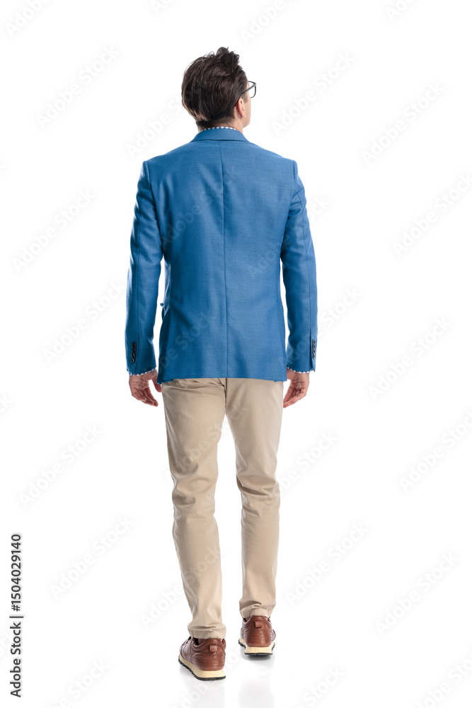 Fototapeta premium casual young guy in blue jacket stepping forward and looking up