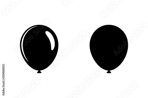 Two black balloons floating in the air