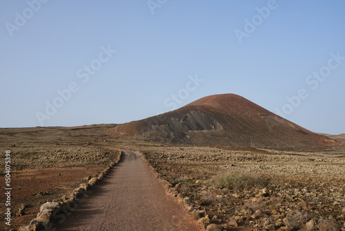 Path to the crater of the volcano Calderón Hondo, Corralejo, north coast of Fuerteventura, Canary Islands.