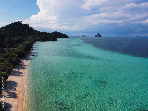 Stunning aerial view of Ko Kradan tropical beach with white sand, turquoise water and lush green vegetation, idyllic paradise landscape in Thailand photo