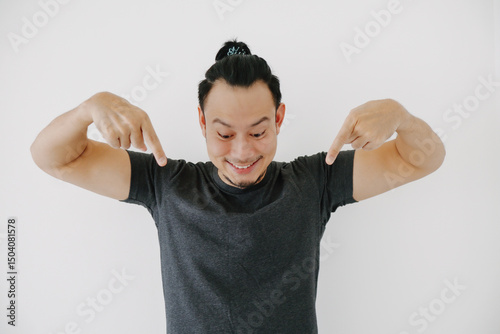 Happy smile man face hand pointing, in black t-shirt isolate on white.